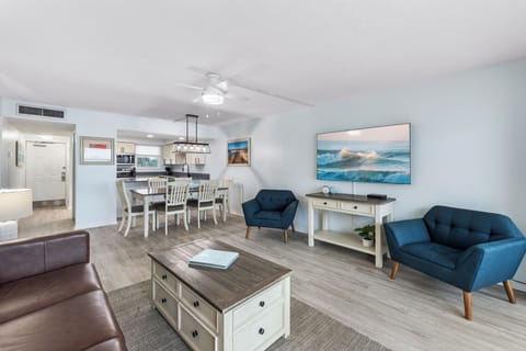 Open-concept living and dining area with coastal-inspired décor