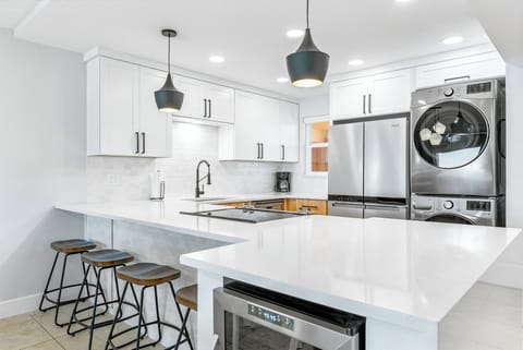 Breakfast bar seats four with in unit washer and dryer provided