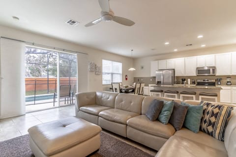 Modern, bright and inviting open concept living, dining and kitchen with access to the private pool!