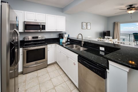 Kitchen - Great appliances and all you need to whip up a delicious meal. Save on the vacay budget by dining IN with a view still!!