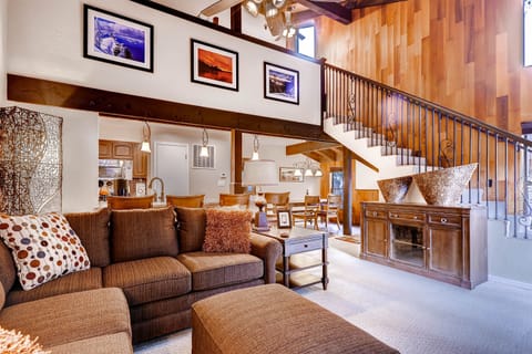 Relax in your spacious loft-style retreat with soaring ceilings, warm wood accents, and cozy seating perfect for unwinding after mountain adventures.