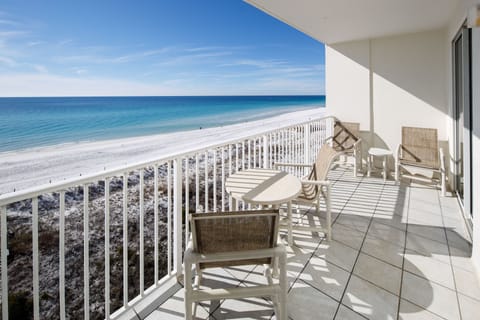 Balcony view - The views from this top floor two bedroom are amazing! The gorgeous beach is right in front of you, enjoy sitting on the patio watching the dolphins.