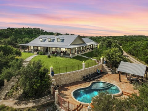 A stunning ranch-style property nestled among rolling hills