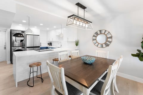 Beautiful dining space featuring a rustic wooden table with seats six