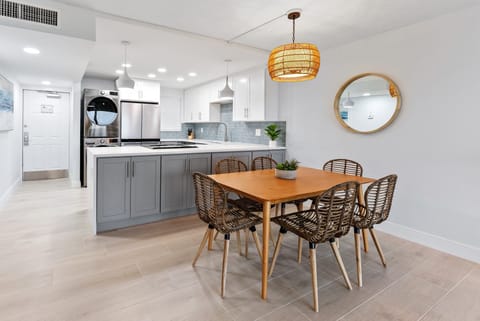 An elegant dining area with a spacious open kitchen