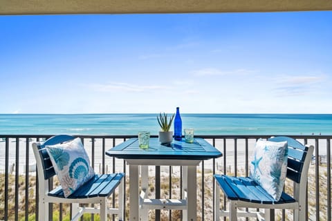 Beachfront view from the balcony - Get an amazing, up-close, beachfront view from the balcony of this unit! Enjoy the sights from sunrise to sunset in this barista table & chair set! The balcony can be accessed from the living area and the master bedroom.