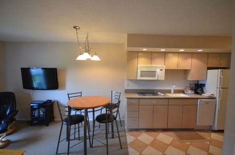 Kitchenette with stove top, mini dishwasher, and microwave. - Kitchenette with stove top, mini dishwasher, and microwave.