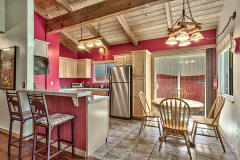 Comfortable kitchen with a cozy conversation table and 2 seats at the bar