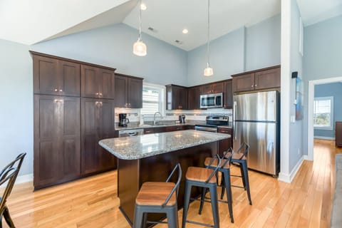 Kitchen with Bar Seating on Third Level