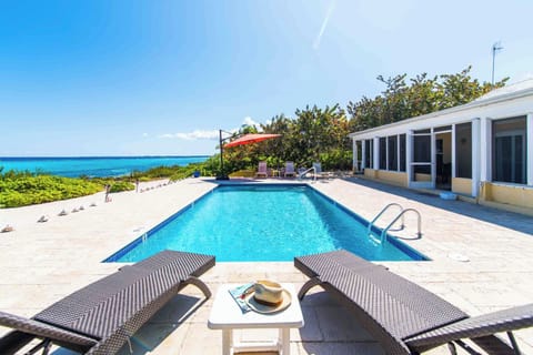 Welcome to Thatch Hill, a 4-bedroom beach house with a private pool and backyard beach in beautiful Rum Point. 