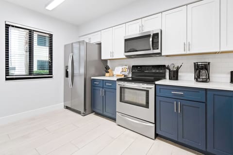 Fully equipped kitchen with sleek finishes, modern appliances, and everything you need to dine in with ease.