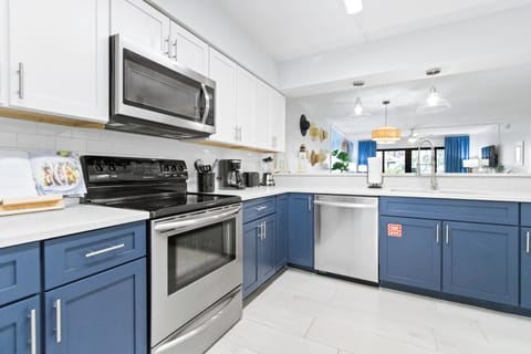 Spacious kitchen with beautiful cabinetry, stainless steel appliances, and plenty of prep space for home-cooked meals.