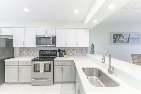 Beautiful and fully renovated kitchen with new cabinets, quartz counters and lots of items to make a delicious meal in!