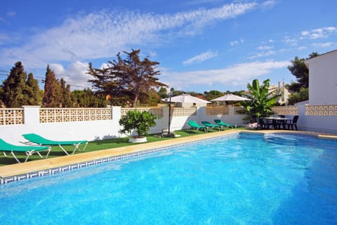 Pleasant summer villa with private pool in Calpe (Costa Blanca) for 12 people, with six bedrooms and four bathrooms, spread over two floors. It has air conditioning in the living room and in all bedrooms.INTERNAL: This villa consists of the GROUND FLOOR, which consists of a living-dining room with TV SAT/TDT, air conditioning, an American bar and access to the terrace and the pool. A fully equipped separate kitchen with dishwasher and ceramic hob. Two bedrooms each with a double bed. There is also a bathroom with a shower. The UPPER FLOOR consists of three bedrooms, each with two single beds, two of them with a bathroom with shower en suite. A double bedroom and finally a washroom.EXTERNAL: A large 10x5 pool fenced for child safety with roman steps and outside shower. There is also a built in barbecue and parking for 4 vehicles on the same property.LOCATION: Without a doubt, an unbeatable location, just 250 m from the nearest supermarket and restaurants. The sandy beach with all services is only 650 m away. There is also a cove 400 m away and Calpe town center 3 km away.REMARKS: Free wifi. Pets up to 12 kg are allowed at an additional cost.