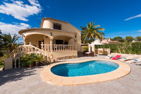 This beautiful holiday villa is located in Moraira, on the Costa Blanca, and can accommodate up to 8 people. With four bedrooms and two bathrooms spread over two floors, it offers all the space necessary for a comfortable and relaxing stay.Inside, the ground floor has a spacious living-dining room with satellite and terrestrial television, a fully equipped independent kitchen with ceramic hob and dishwasher, and access to a covered terrace and the pool. There are also two bedrooms with two single beds each, a bedroom with a double bed and a separate bathroom with a bathtub. On the upper floor, there is another bedroom with a double bed and an en-suite bathroom with a bathtub and access to a solarium.Outside, there is a large terrace with a private 7.5x3 meter pool, with Roman stairs and an outdoor shower. In addition, there is a built-in barbecue to enjoy meals outdoors. Parking for two vehicles is located on the same plot, which is completely closed.The location of this villa is ideal for those who want to do without the vehicle during the holidays. It is located just 750 meters from the sandy beach and all the restaurants in the area. The nearest supermarket is 1 km away and the center of Moraira is just 780 meters away.Some additional notes are that free WiFi is provided in the villa and that pets up to 12 kg are allowed with an additional fee.