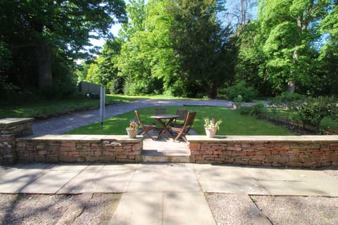 The Studio patio and garden leading into woodlands