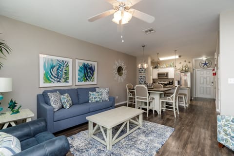 Relax in your bright, open living space with coastal touches and a ceiling fan to keep you cool.
