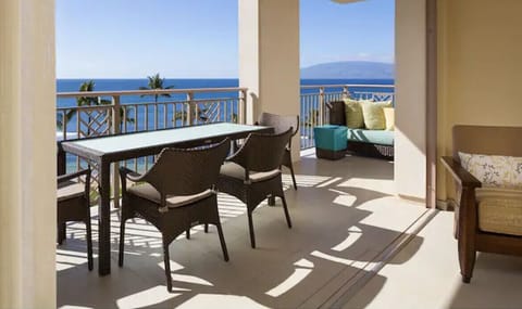 Huge balcony with dining table and a chaise