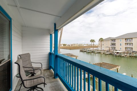 Unwind on your private waterfront balcony with comfortable seating as you watch boats drift by the marina below.