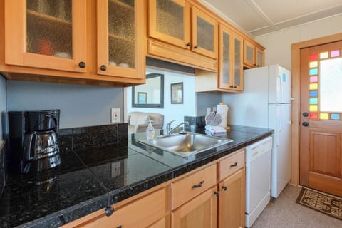 Kitchen has new fir cabinets - Granite counters & new fir cabinets.