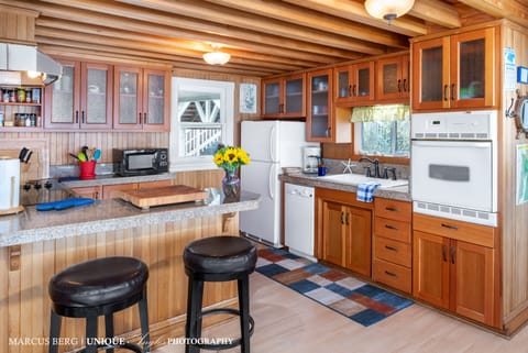 Beachfront Kitchen - Beautiful new fir cabinetry and granite counters. Every supply you'd need to create a beautiful oceanfront meal for the gang.