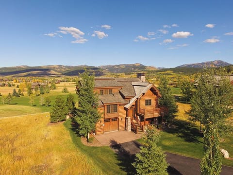 Your stunning mountain retreat awaits with breathtaking valley views and golden autumn colors stretching to the horizon. Feel the crisp mountain air as you relax on your private deck.