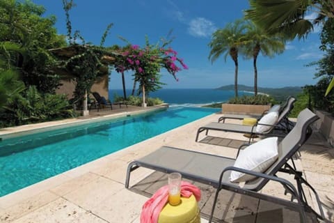 Step into your private infinity pool surrounded by vibrant gardens, where tranquility and luxury combine to create an unforgettable outdoor escape in Tamarindo.
