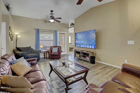 Hero shot - Spacious living room with comfortable seating for 8 guests in quiet Las Vegas vacation rental.l