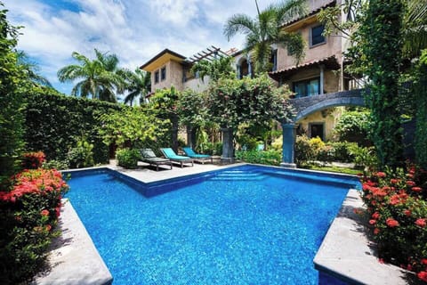 Enjoy sunny days by the serene swimming pool, shared by only 5 villas in Langosta Beach, an exclusive community next to Tamarindo, Costa Rica.