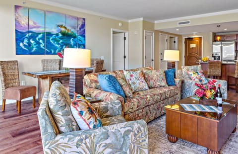 Living room features a queen convertible sofa-sleeper
                