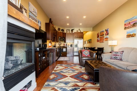 Spacious living room connected to kitchen and dining area.