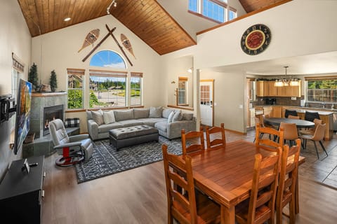 Evergreen Lodge. - Great room with a large comfortable sectional couch and extra dining table.