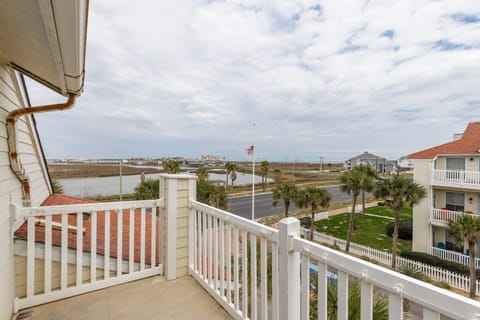 Step out onto your private balcony and breathe in the coastal air while taking in panoramic views of palm-lined streets and distant water.