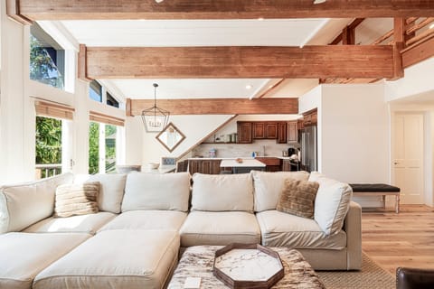 Penthouse A living room with 70" smart TV, fireplace and updated sofa and furnishings