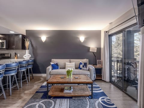 Living Area with HD Smart TV, Wood Burning Fireplace, San Francisco Designs Sofa Pullout and Deck Access