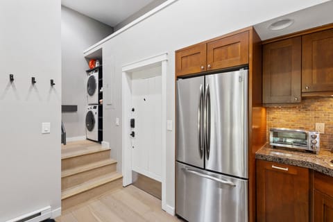 The entryway of Columbia 8. Ski storage is a locker in the interior hallway of the building.