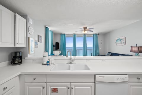 Fully Stocked Kitchen with Bar Seating