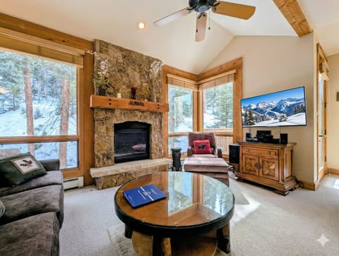 Cozy up by your stone fireplace while snow falls outside your windows, creating the perfect mountain retreat atmosphere.