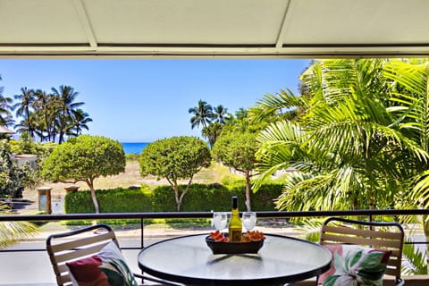 Sip your morning coffee beneath the swaying Palms