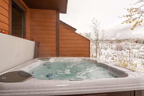 Let your worries melt away in the private hot tub on the patio