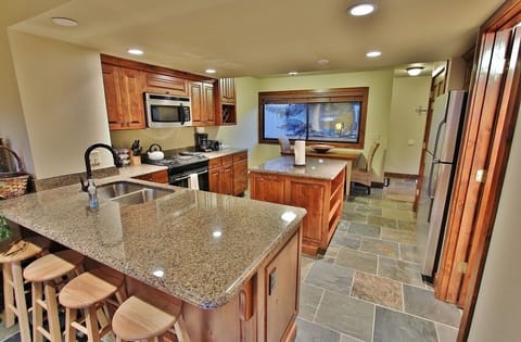 Kitchen with stainless steel appliances and granite counter tops in Park City Racquet Club Village - Park City