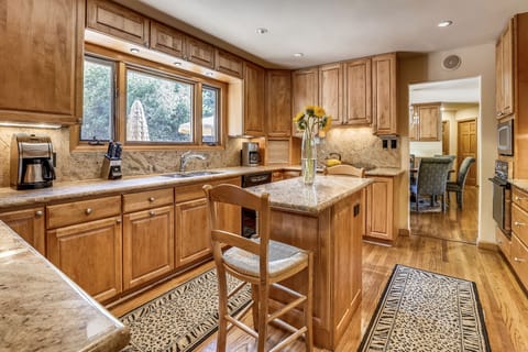 Large open upstairs kitchen overlooks back deck