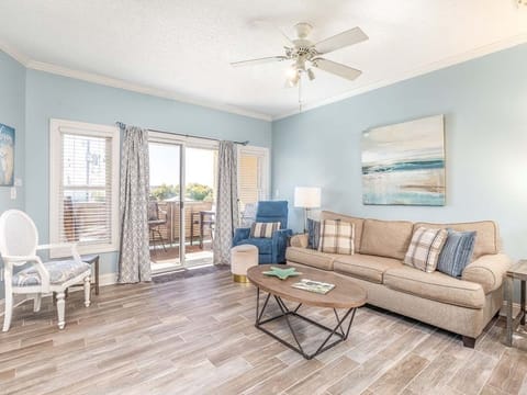 Sandpiper 207 - Living area with TV and balcony access