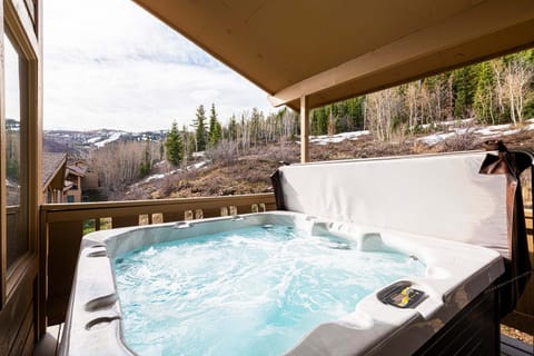 Enjoy beautiful mountain view from the private hot tub on upper level back deck