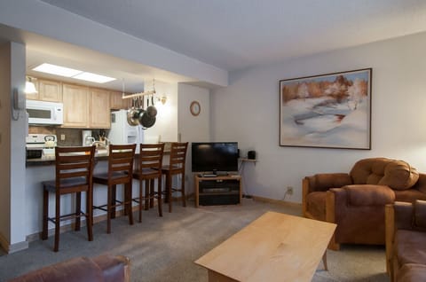 breakfast bar serves as dining area and seat fours