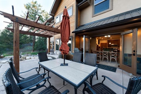 Outdoor living space - Dining Table, BBQ, couch and gas fire pit