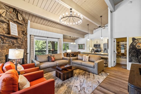 Snuggle up in the large living space with vaulted ceilings, cozy furniture, and a warm fireplace.