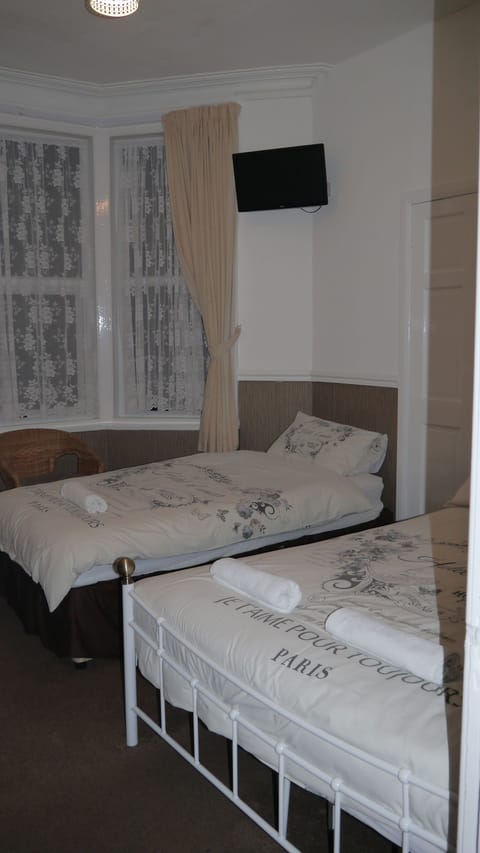 Triple Room | Individually decorated, individually furnished, blackout drapes