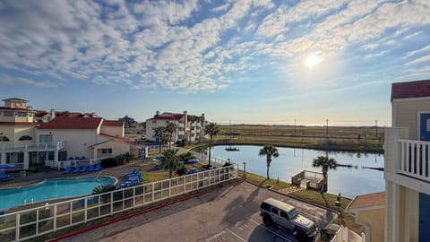 Scenic waterfront property with stunning lake views, swimming pool, and natural landscape surroundings.