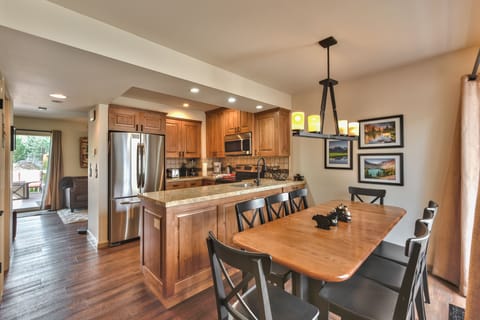 Entry into Dining Area, Kitchen and Living Room with Beautiful Hardwood Floors Throughout